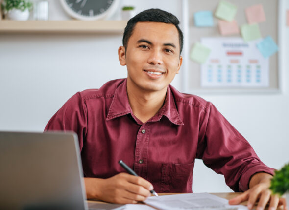 A man working in office with papers